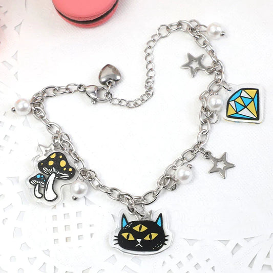 Custom acrylic bracelet with cat, mushroom, diamond, star charms and pearl accents on a silver chain