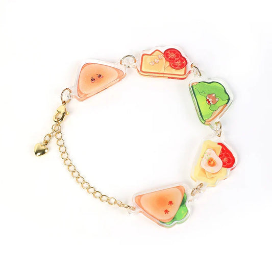 Custom acrylic charm bracelet with colorful sandwich designs and gold chain on white background
