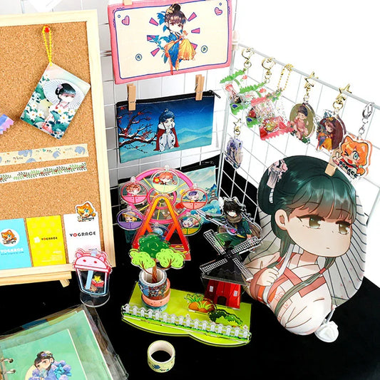 Assorted anime-themed acrylic keychains, pouches, charms, washi tape, and standees on display.