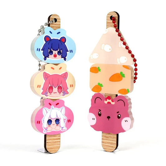Custom acrylic dango keychains with cute animal faces and colorful food-themed designs on wooden sticks