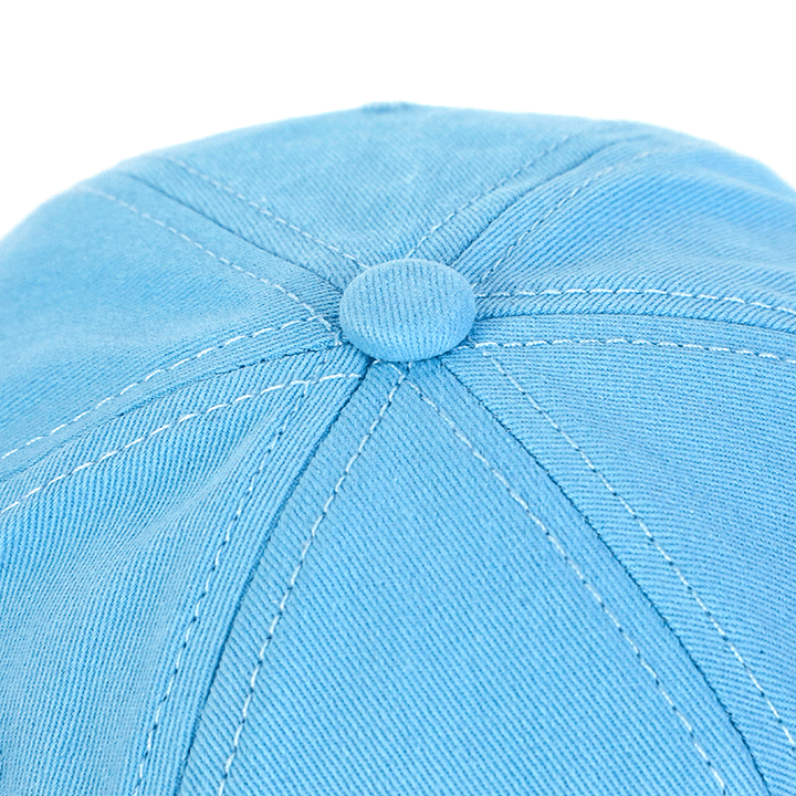Close up of light blue custom baseball cap with stitched panel details