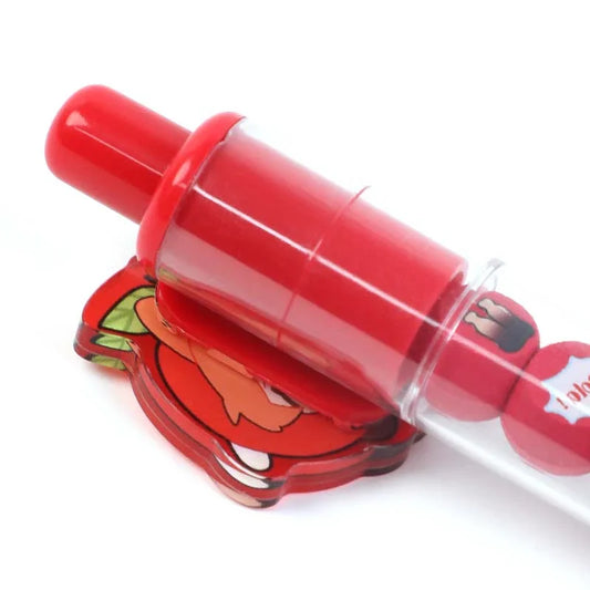 Close-up of custom red acrylic ballpoint pen with cartoon character charm, beadable design