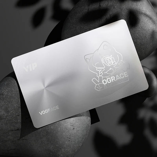 Silver membership VIP card with engraved cartoon mascot and VOGRACE text on a dark stone background