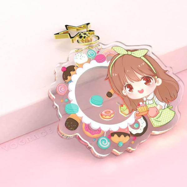 Custom acrylic shaker keychain with cute anime girl, desserts, and gold star clasp.